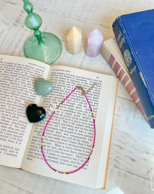 Colorful Beaded Necklace with Pink, Yellow, and Black Accents